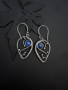 Zeloutis Wearable Art - Uncommon wire wrapped sterling and fine silver wearable art jewelry featuring semi-precious gemstones and artisan glass.