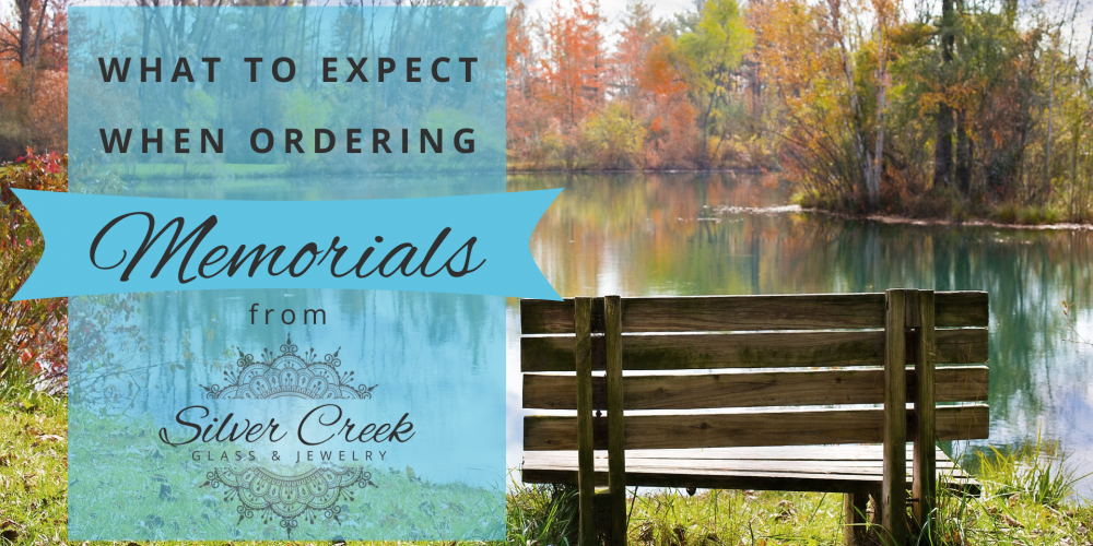 Picture of an empty wood bench by a pond with text that reads "what to expect when ordering memorials from Silver Creek Glass & Jewelry