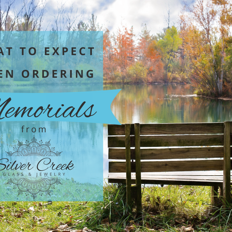 Picture of an empty wood bench by a pond with text that reads "what to expect when ordering memorials from Silver Creek Glass & Jewelry