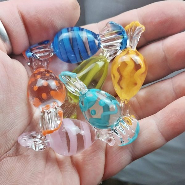 Image of hand holding a set of glass easter candy